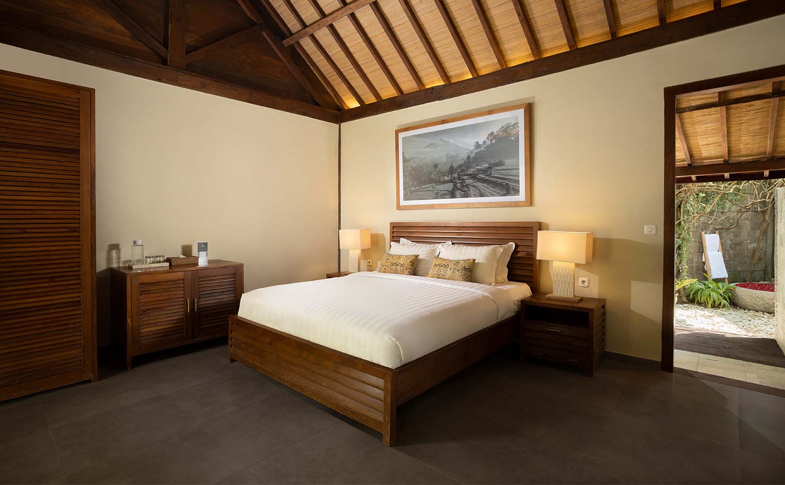 Villa Tirtadari - wooden-themed bedroom in luxurous joglo-style Villa in Kerobokan